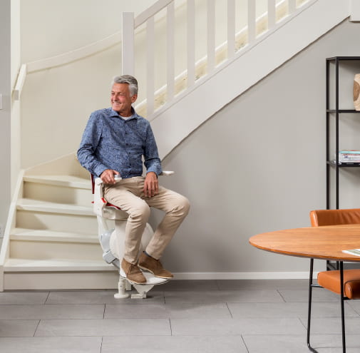 Otolift Modul-Air Curved Stairlift at bottom of stairs - Breffni Mobility | The Stairlift Specialists