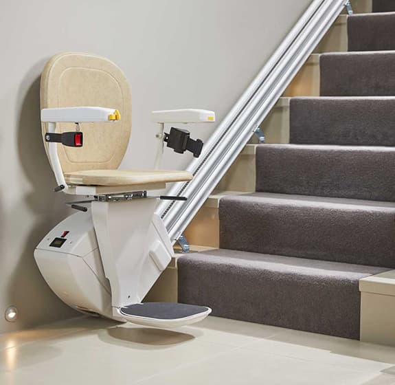Synergy Stairlift at the bottom of straight stairs | Breffni Mobility The Stairlifts Specialists